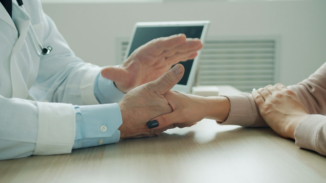 Doctor providing compassionate care to senior patient